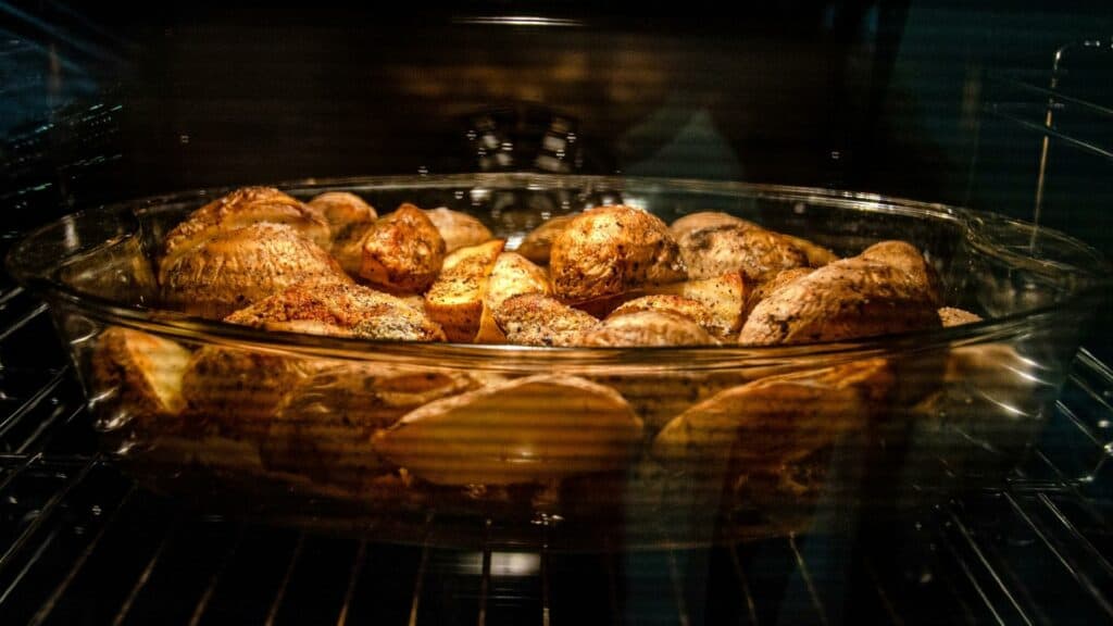 baking potatoes in the oven inside a glass dish