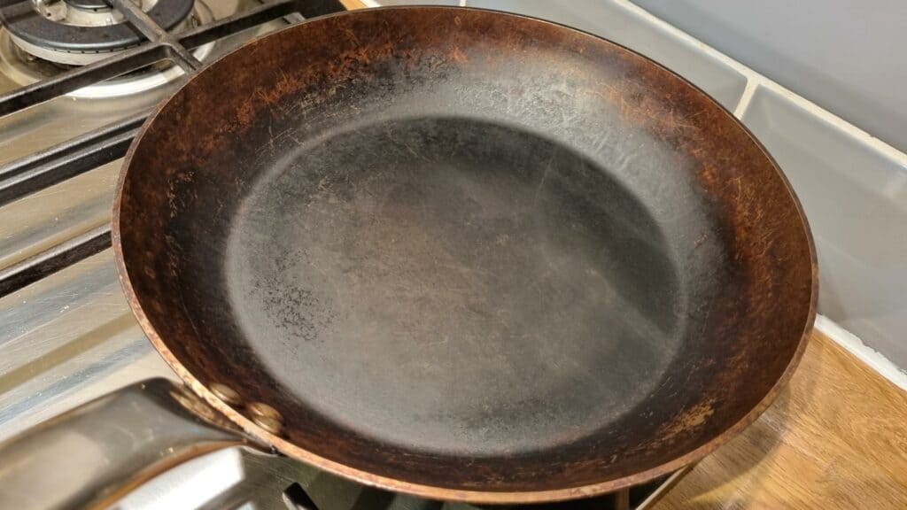 carbon steel pan drying on stovetop