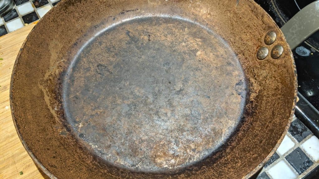 carbon steel pan with rust all over